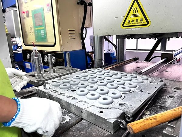 silicone molding production line showing multi-cavity molds